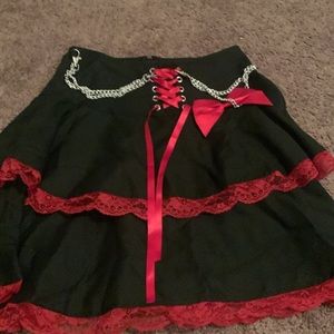 Black skirt with red lace and chains